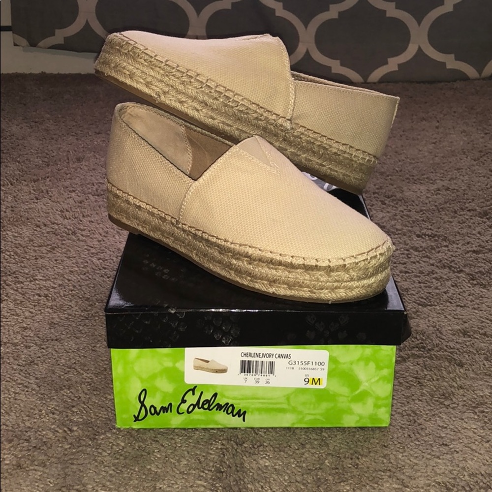 Women’s size 9 ivory canvas slip on shoes.